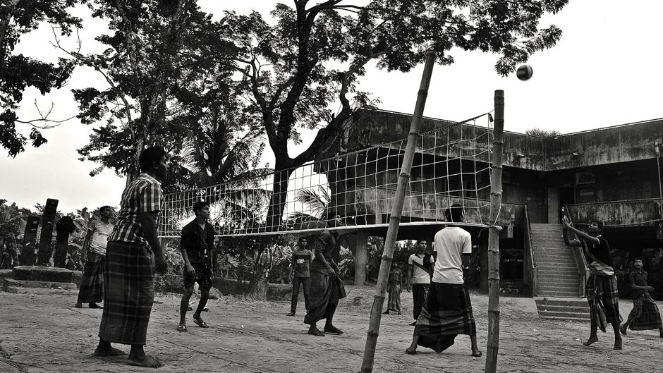 A group of young men playing volleyball in front of the cyclone shelter as the sun goes down in Gabtola, one of the coastal study sites in Bangladesh. Photo: © 2014 Sonja Ayeb-Karlsson. All rights reserved.