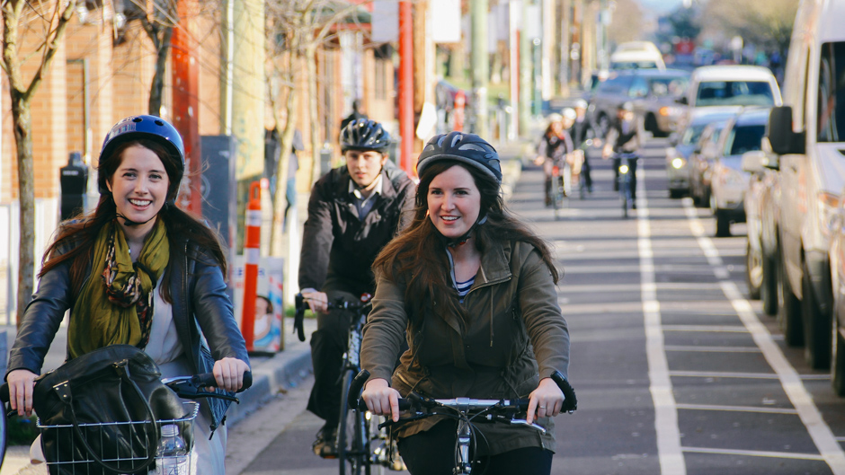 Car parking-protected bike lane in Vancouver, British Columbia. Photo: Paul Krueger. Creative Commons BY-NC 2.0 (cropped).