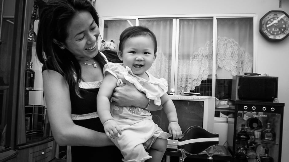 Nguyen Thi Diem Chi and her daughter Nguyen Lam Gia Lac at their house in Ho Chi Minh City.